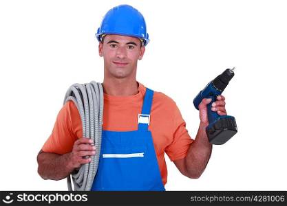 Electrician with wiring and cordless drill