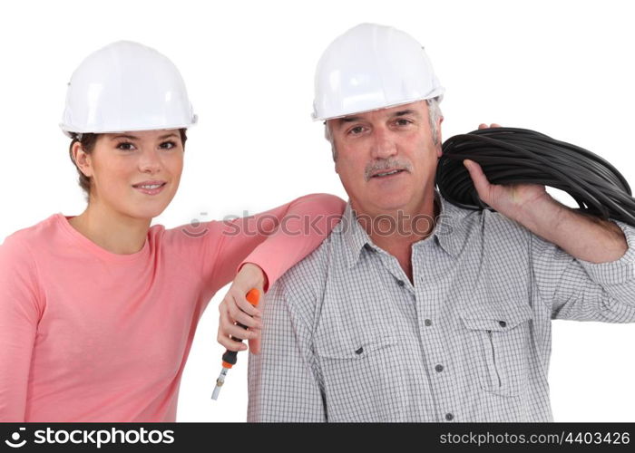 Electrician with young apprentice