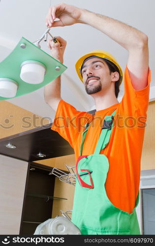 Electrician working on cabling lighting