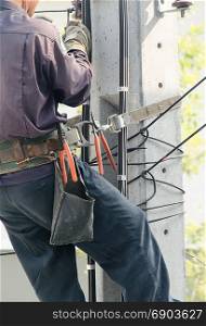 Electrician works in the height