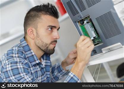 electrician works with machine electronic
