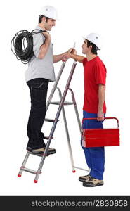 Electricians on white background