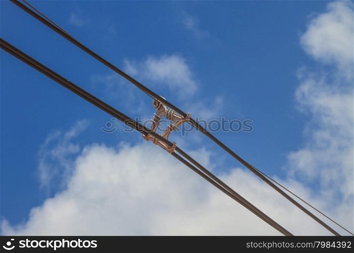 electricity pole on blue sky background in a village