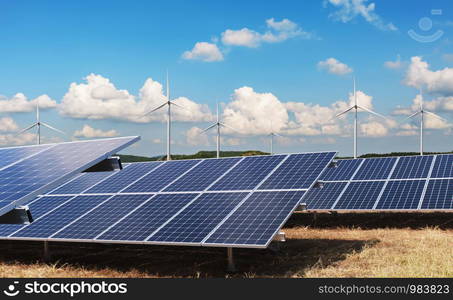 electricity power in nature. clean energy concept. solar panel with turbine and blue sky background