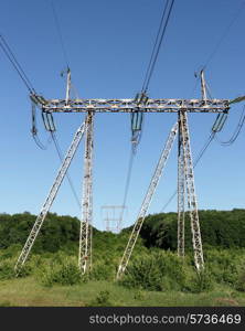 Electricity pylon power pole high voltage against blue sky