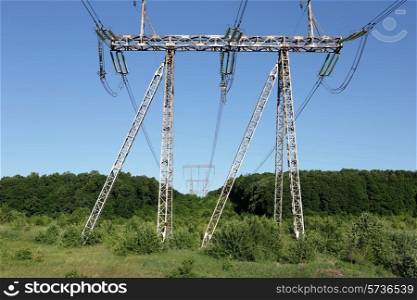 Electricity pylon power pole high voltage against blue sky