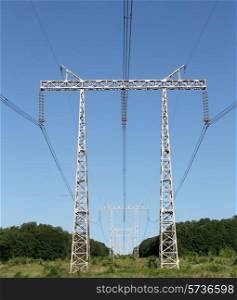 Electricity pylon power pole high voltage against blue sky