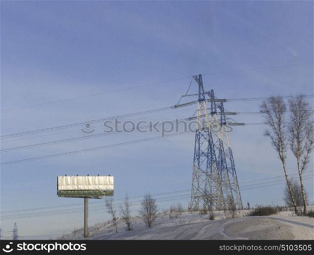 Electricity Pylon standard overhead power line transmission tower on the sky background. Electricity Pylon standard overhead power line transmission tower on the sky background.