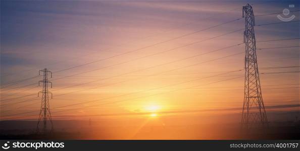 Electricity pylons at sunrise