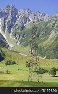 electricity pylons crossing the Swiss Alps. Bern Canton, Switzerland