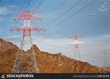 Electricity pylons in mountain landscape