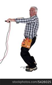 Electrocuted man holding jumper cables