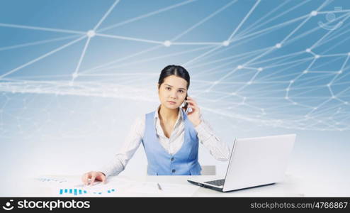 Electronic business and networking. Businesswoman at table working on laptop presenting social connection concept