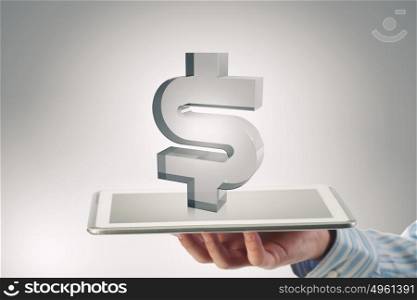 Electronic business concept. Tablet in hand with dollar currency symbols