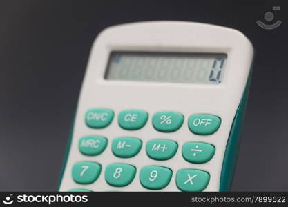 Electronic calculator in black background