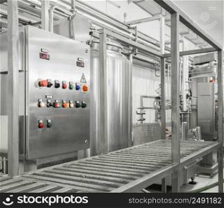 electronic control panel and tank at a milk factory. equipment at the dairy plant. equipment at the milk factory