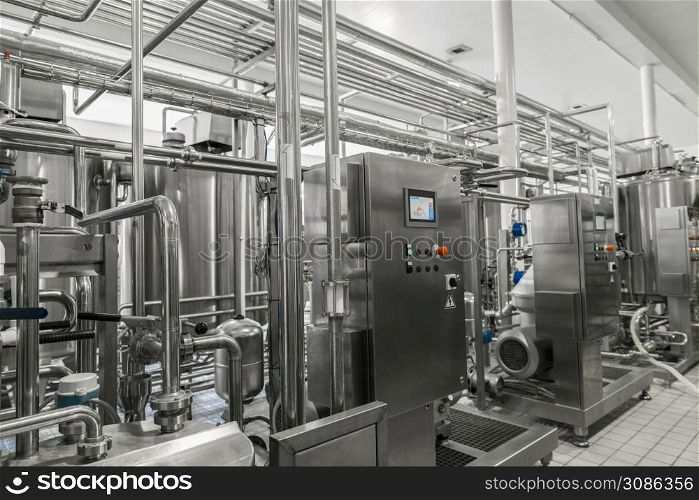 electronic control panel and tank at a milk factory. equipment at the dairy plant. equipment at the milk factory