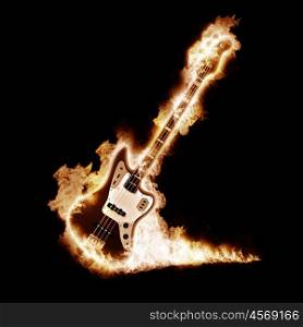 Electronic guitar enveloped flames on a black background