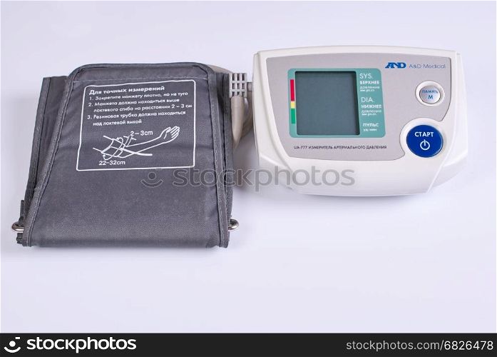 Electronic medical tonometer on a white background.. Medical equipment - automatic blood pressure monitor on a white background.