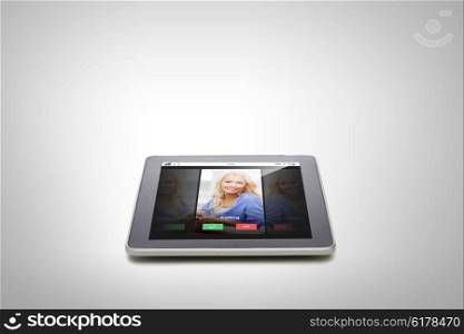 electronics, technology, advertisement and modern gadget concept - close up of tablet pc computer with incoming call from woman on screen over gray background