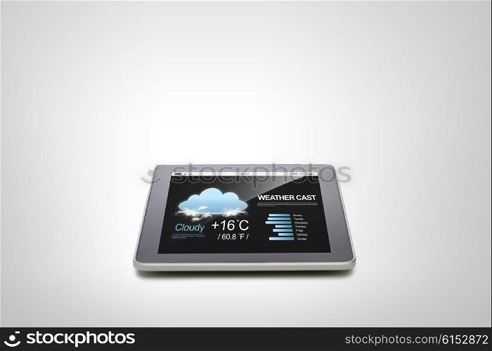 electronics, technology, weather cast and modern gadget concept - close up of tablet pc computer with meteo forecast over gray background