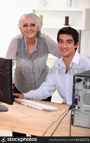 elederly woman learning how to use computer