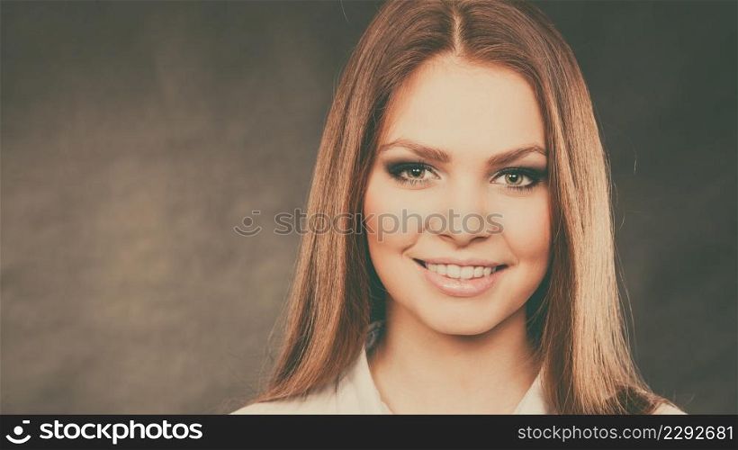 Elegance and beauty of women. Close up of female face with beautiful elegant dark eyes make up. Young woman with stunning amazing facial look.. Glamorous woman with elegant eyes make up.