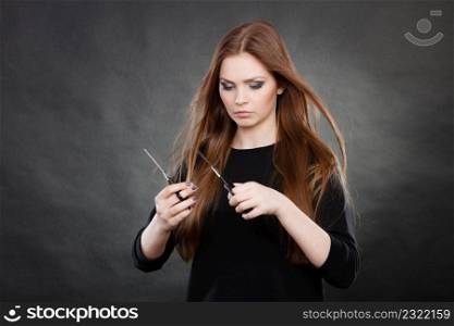Elegance and classy. Fashion style of hairdo. Female professionalist with scissors. Elegant woman presents her hairdresser&rsquo;s saloon.. Professional elegant female barber with scissors.
