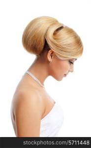 Elegance blond female with creative hairstyle - profile view