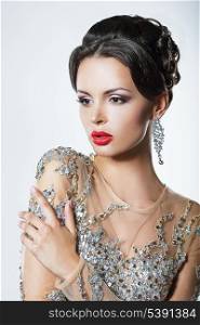 Elegance. Luxurious Good Looking Woman in Dress with Sequins and Jewels