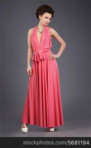 Elegance. Stylish Brunette in Pink Festive Dress