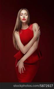 Elegance. Stylish Lady in Red Silky Dress