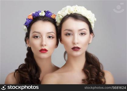 Elegance. Two Women with Wreaths of Flowers. Fantasy