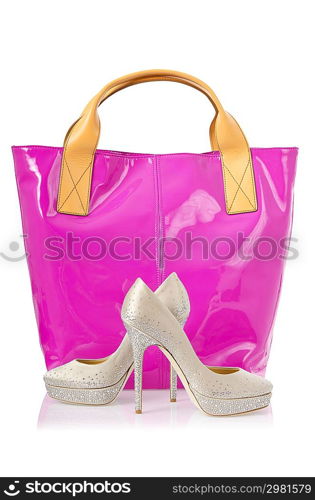 Elegant bag and shoes on white