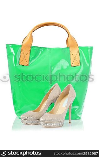 Elegant bag and shoes on white