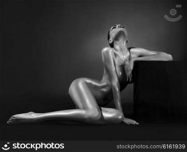 Elegant beautiful nude lady on black background