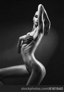 Elegant beautiful nude lady on black background