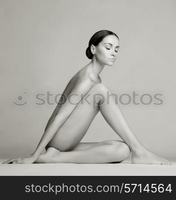 Elegant beautiful sitting lady on white background