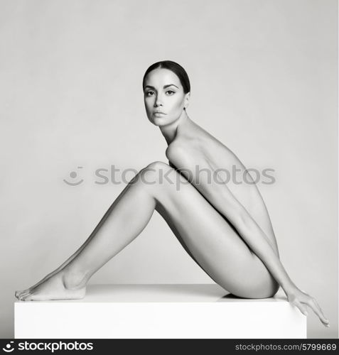 Elegant beautiful sitting lady on white background