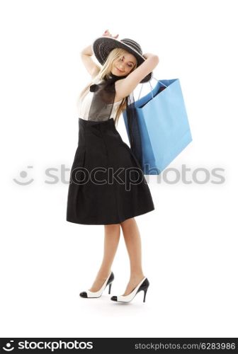 elegant blond in retro hat with blue shopping bag