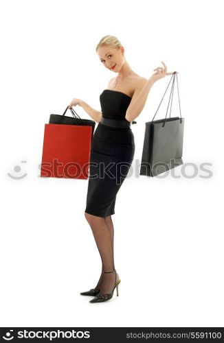 elegant blond with shopping bags over white