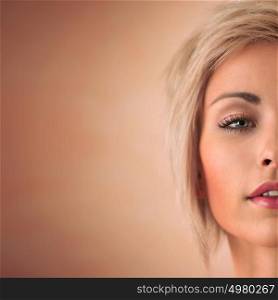 Elegant blonde beauty half face closeup portrait with copyspace