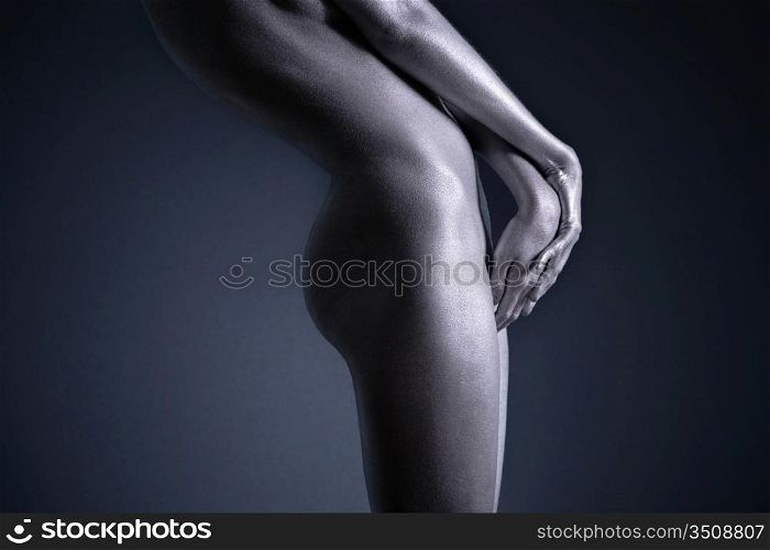 elegant body-art. Nude woman with silver make-up.