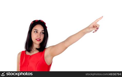 Elegant brunette girl indicating something with her finger isolated on a white background