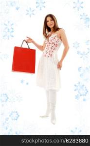 elegant brunette with shopping bags and snowflakes