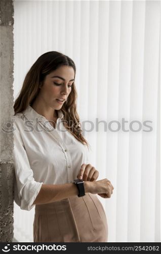 elegant businesswoman with smartwatch