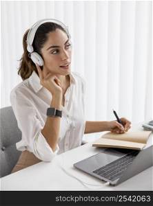 elegant businesswoman working with laptop headphones