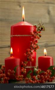 Elegant candles decorated for Christmas. Brighten up your illusion