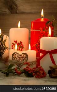 Elegant candles decorated for Christmas. Brighten up your illusion