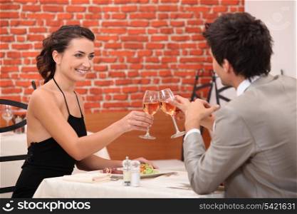 Elegant couple dating in a restaurant